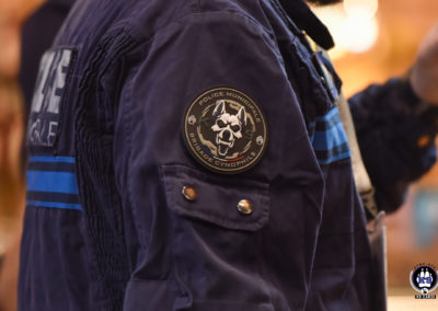 Aperçu d'un visiteur de Cyno-Ops arborant le patch de la Brigade Cynophile de la Police Municipale